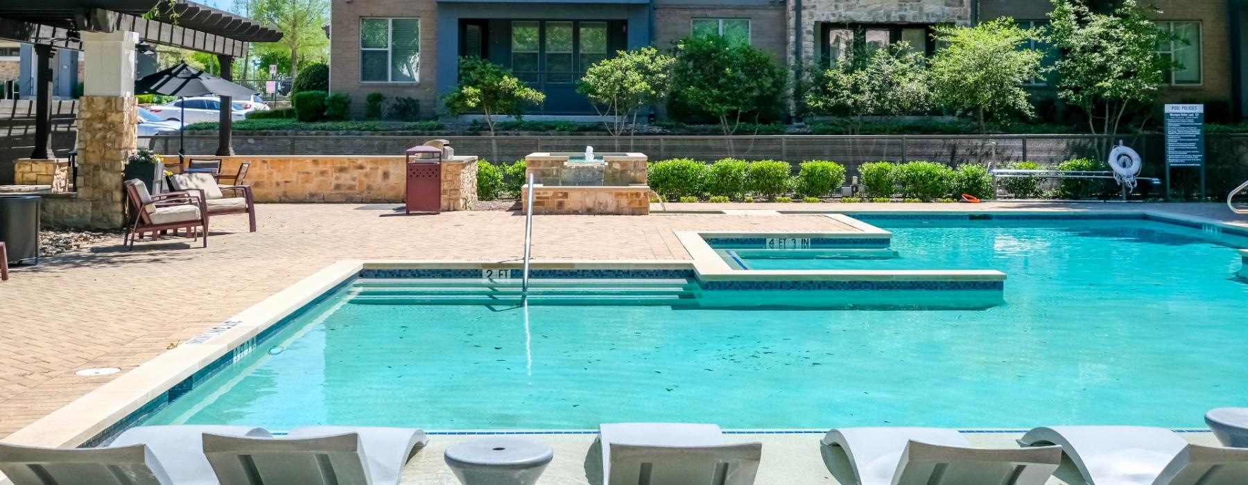 a pool in front of a building