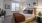 a bedroom with a bed and a fan