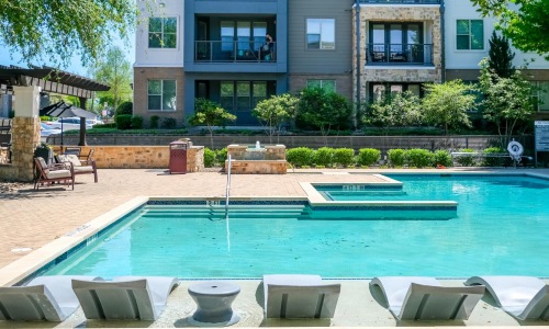 a pool in front of a building
