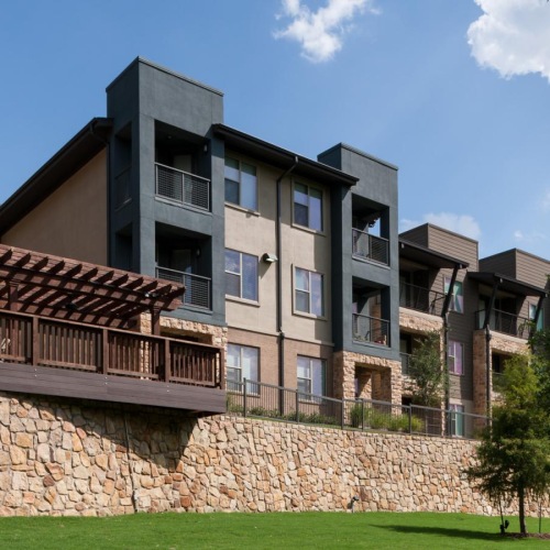 a large building with a stone wall