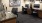 a room with a desk and chairs