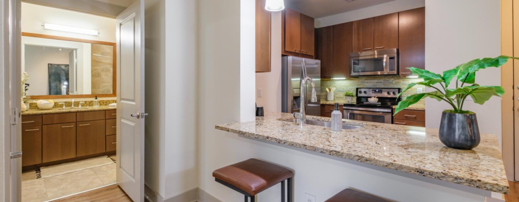 a kitchen with a marble counter top